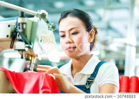 Seamstress in a chinese textile factory 10748883