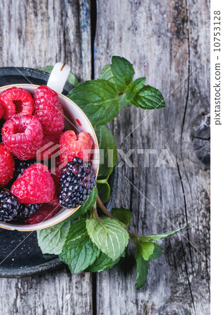 Cup of raspberries and blackberries Cup of raspberries and blackberries 10753128