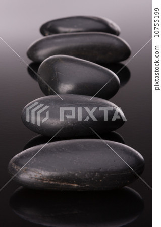 Spa stone arrangement on black surface Spa stone arrangement on black surface 10755199