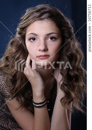 Girl with long curly hair. 10756711