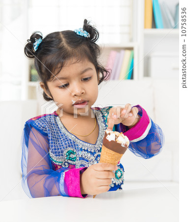 Little girl eating ice cream. Little girl eating ice cream. 10758536