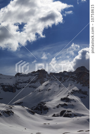 Snow mountains and blue sky with clouds 10758615