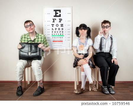Three person wearing spectacles in an office at the doctor 10759546