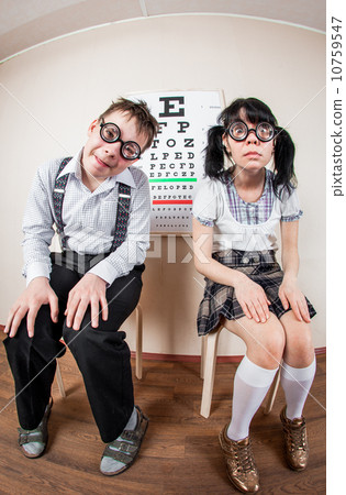 Two person wearing spectacles in an office at the doctor 10759547