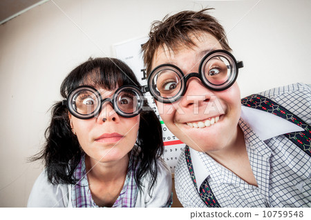 Two person wearing spectacles in an office at the doctor 10759548
