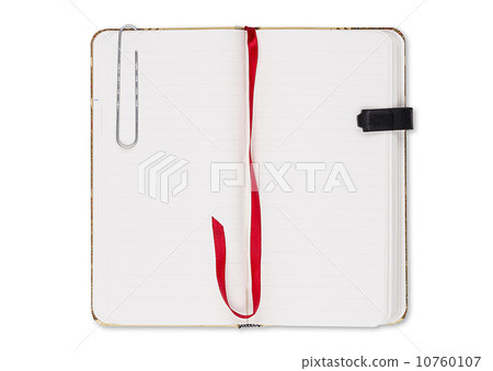 blank page of note book with paper clip and elastic strap isolat 10760107