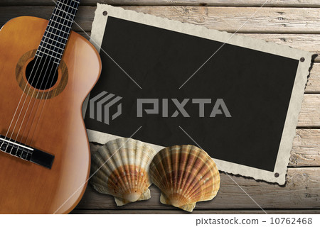 Guitar and Photo Frame on Wood Boardwalk 10762468