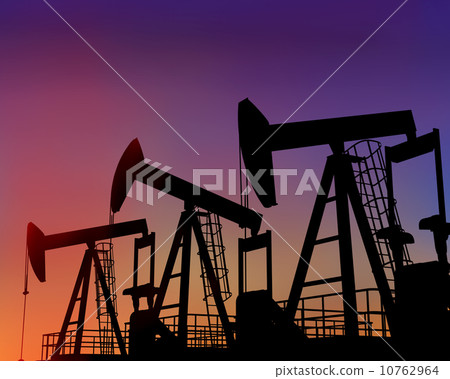Three oil wells in the desert at dusk 10762964