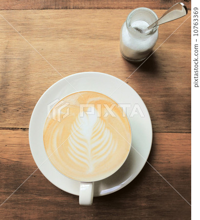 Cappuccino or latte coffee on table with retro filter effect 10763369