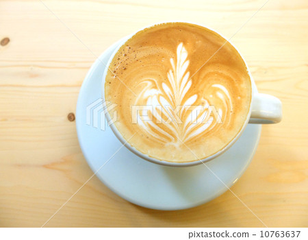 Latte art coffee on wooden table 10763637