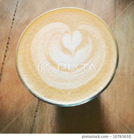 Cappuccino or latte coffee on table with retro filter effect 10763638