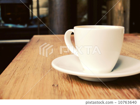 Closeup of cup of coffee on table at coffee shop 10763640