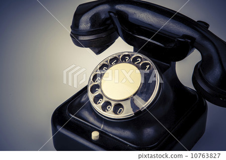 Old black phone with dust and scratches on white background Old black phone with dust and scratches on white background 10763827