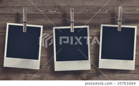 Blank Photo frame on wooden background 10763884