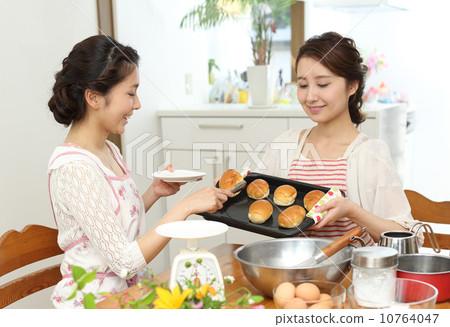 Two housewife baking bread Two housewife baking bread 10764047