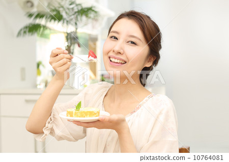 Woman eating cake Woman eating cake 10764081