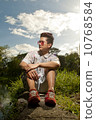 Asian man in printed polo 10768584