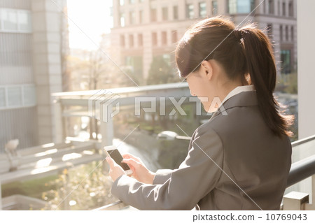 Young business woman use cellphone 10769043