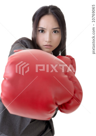 Business woman with boxing gloves 10769065