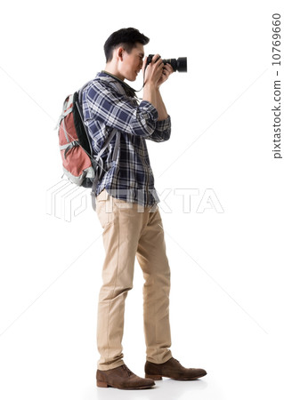 Asian young male backpacker take a picture Asian young male backpacker take a picture 10769660