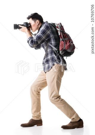 Asian young male backpacker take a picture Asian young male backpacker take a picture 10769706
