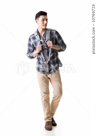 Asian young traveling man walking Asian young traveling man walking 10769719