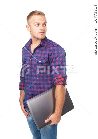 Portrait of smiling young man holding laptop 10773813