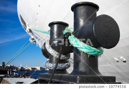 Bundle of rope on the ship mooring bollard 10774558
