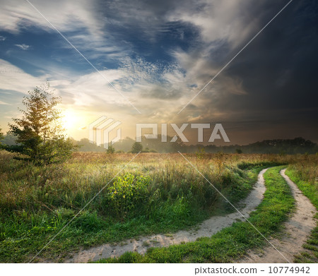 Thunderstorm and country road Thunderstorm and country road 10774942