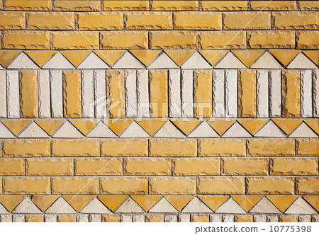 Yellow brick wall texture with white ornament pattern Yellow brick wall texture with white ornament pattern 10775398