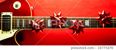 Music gifts red electric guitar and wrapping ribbon 10775876