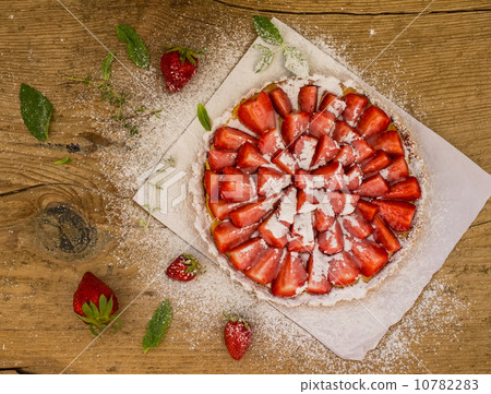Straberry cheesecake on a wooden desk Straberry cheesecake on a wooden desk 10782283