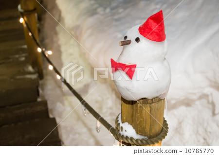 snowman against winter night scene in snow snowman against winter night scene in snow 10785770