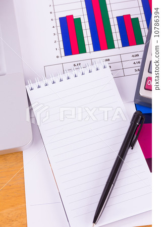 blank notepad, documents and calculator in the office blank notepad, documents and calculator in the office 10786394