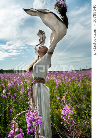 Beautiful girl relaxing with flowers 10789640