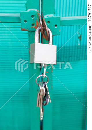 green door locked with padlock 10791747