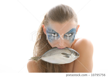 Woman in make-up with fish in mouth 10795756