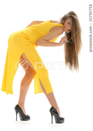 Beautiful young woman in yellow dress Beautiful young woman in yellow dress 10795758