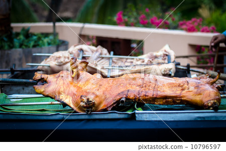 roasted pig on a spit. 10796597