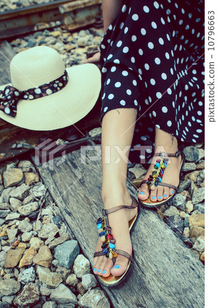 Traveller girl sitting on the rail way, 10796663