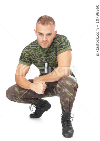 Portrait of young army soldier squatting Portrait of young army soldier squatting 10796960