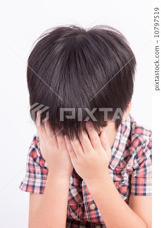 Young little boy crying or playing with hiding face 10797519