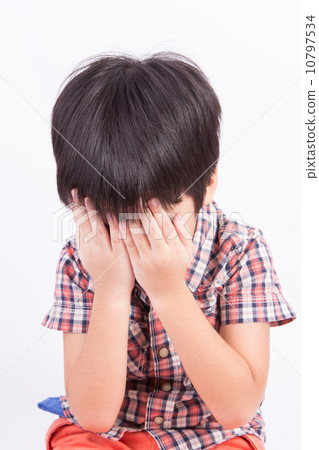 Young little boy crying or playing with hiding face 10797534
