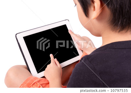 Hand of Asian boy playing Tablet isolated on white Hand of Asian boy playing Tablet isolated on white 10797535