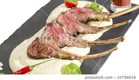 lamb ribs cooked on the grill served on a hot stone lamb ribs cooked on the grill served on a hot stone 10798639