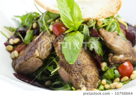 rabbit liver salad with arugula in a restaurant 10798664