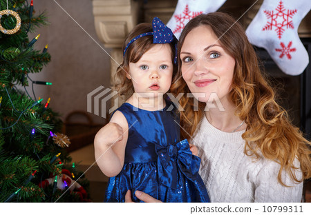 Little girl and mother with Christmas tree and decoration 10799311