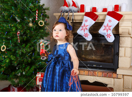 Little girl being happy about christmas present. Little girl being happy about christmas present. 10799397