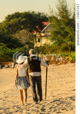 Couple of lover relax on Hua Hin Beach 10803167