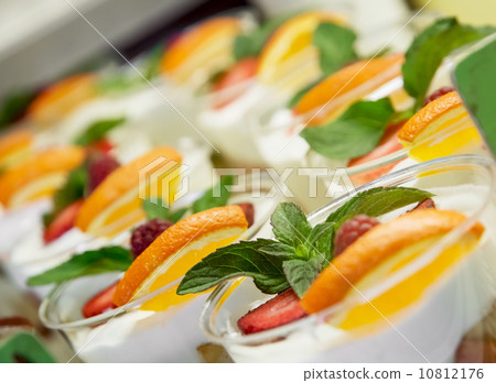 Yogurt cups with fruit and mint 10812176